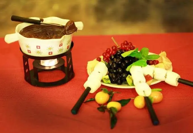 Melted chocolate with fruits and marshmallows